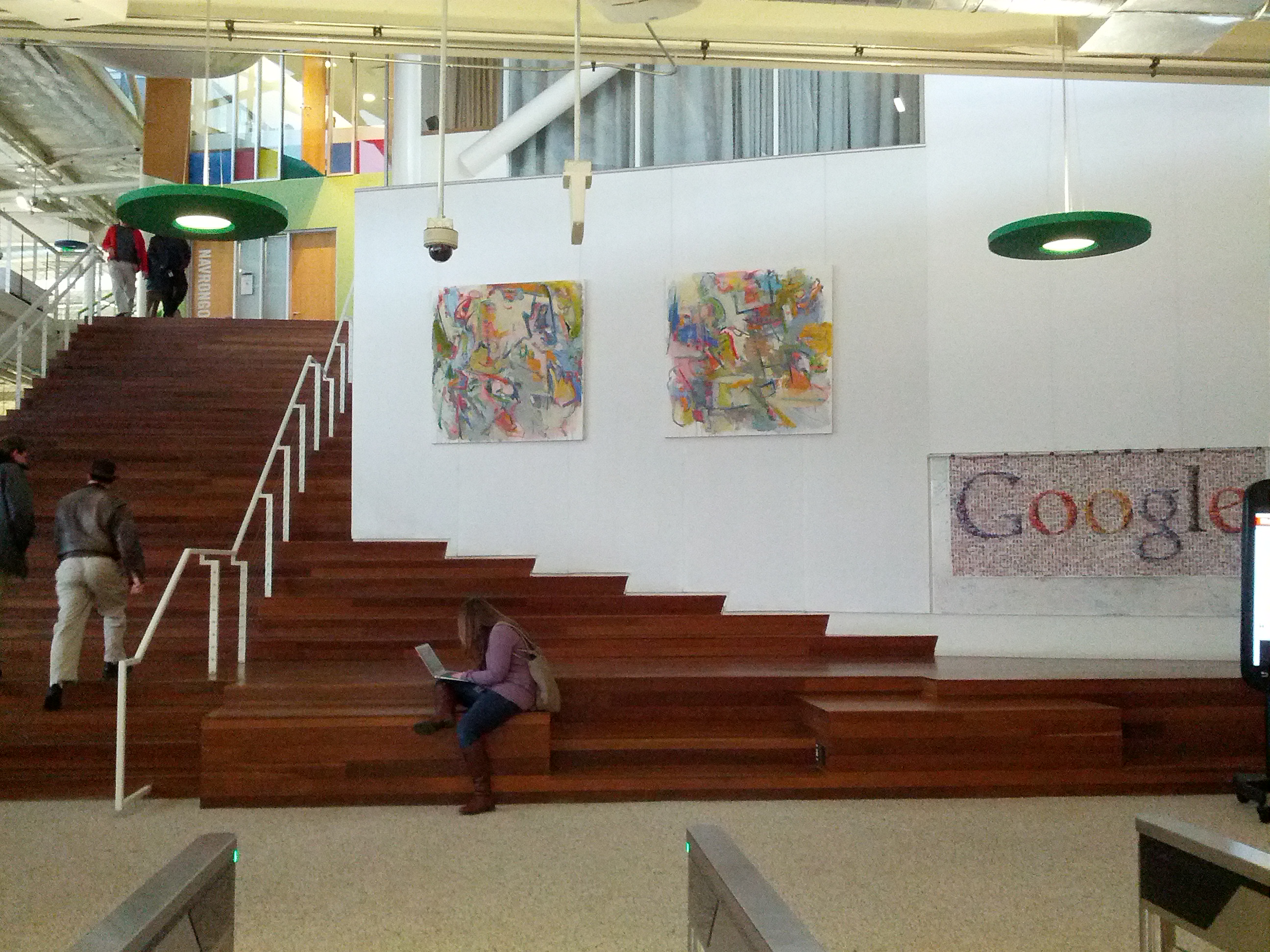 Google lobby exhibition — abstract paintings by staircase