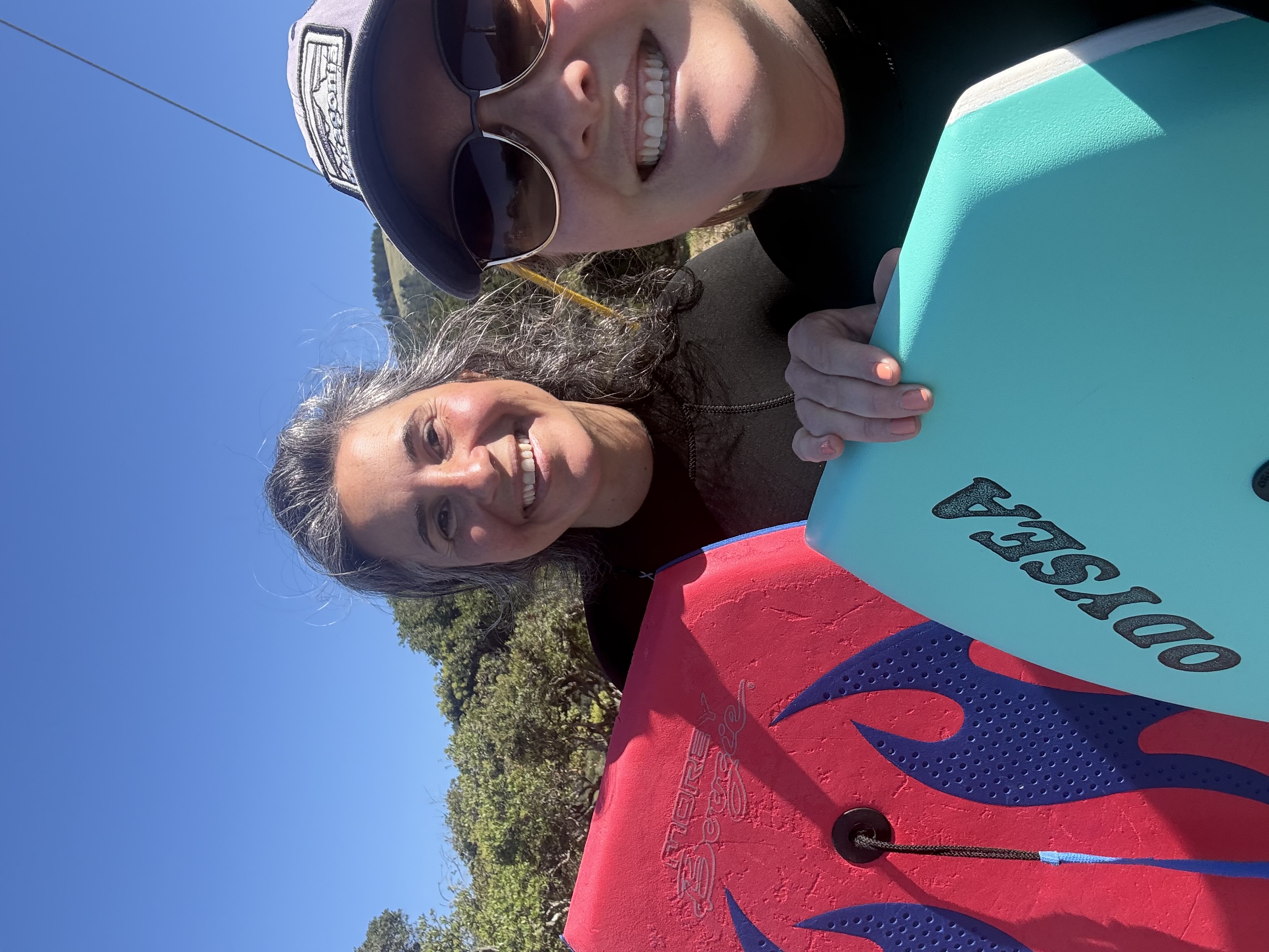 Cris and friend with surfboards