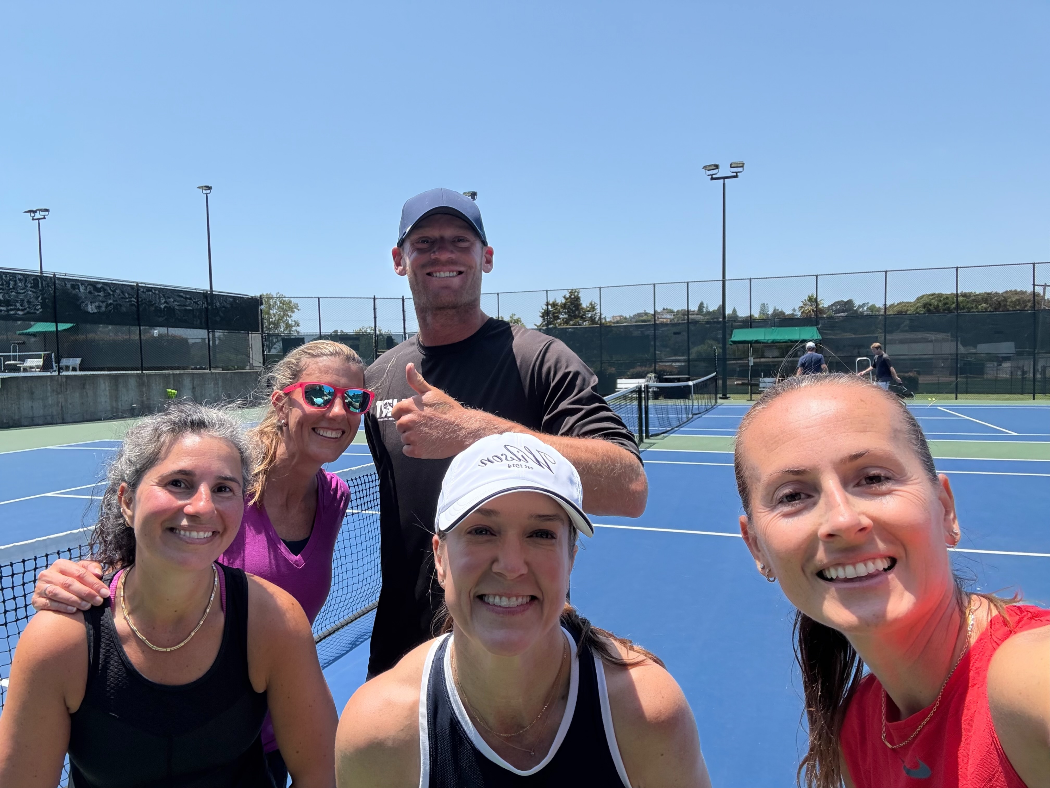 Cris with friends on the tennis court